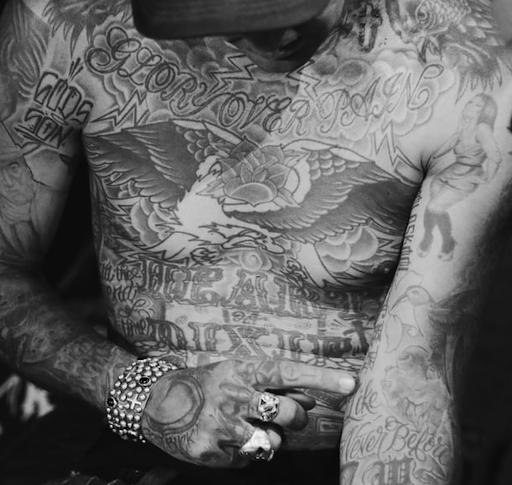 man with full body of tattoos