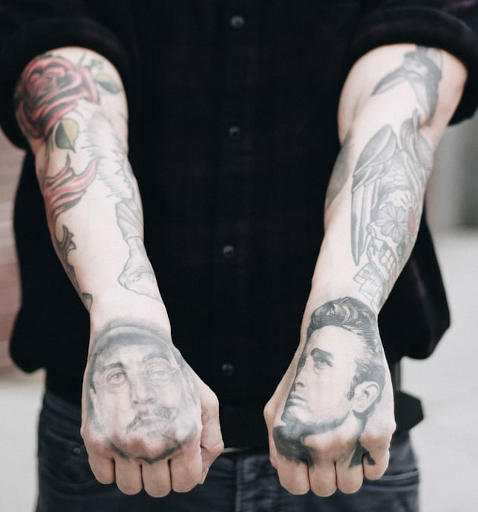 man with tattoos on arms